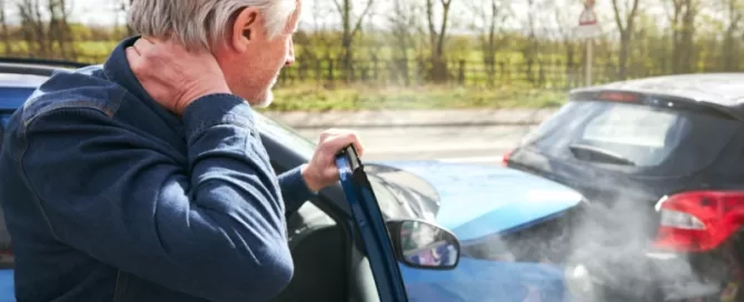 man holding neck after car accident attorney boca raton florida